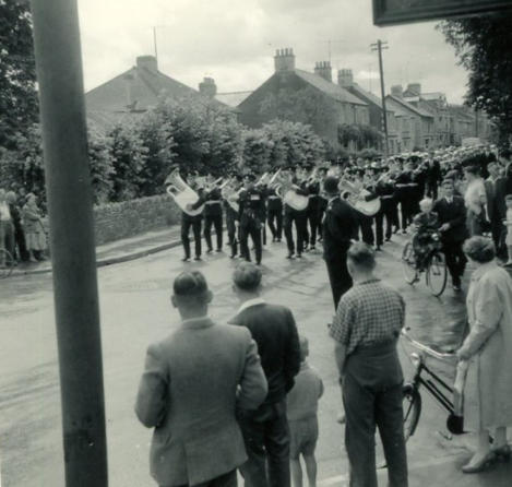 Band leading procession from school, up Victoria Road to Parish church