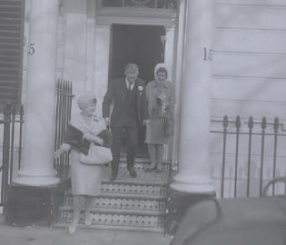 13th March 1965 - Richard Waddington and Clare Stanhope-Lovell wedding.  Couple leaving and Shelia Hornby (mother of bride) on right